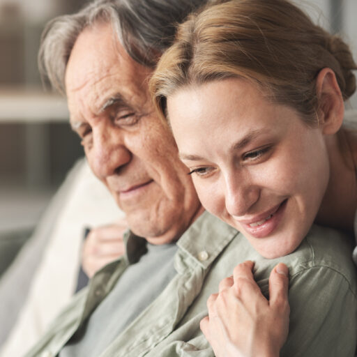Woman hugging senior man with Alzheimer's, debunking the myths about dementia