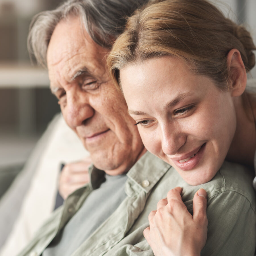 Woman hugging senior man with Alzheimer's, debunking the myths about dementia