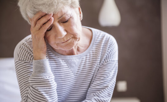 Seasonal depression in seniors can be difficult to manage. Here a senior woman feels blue.