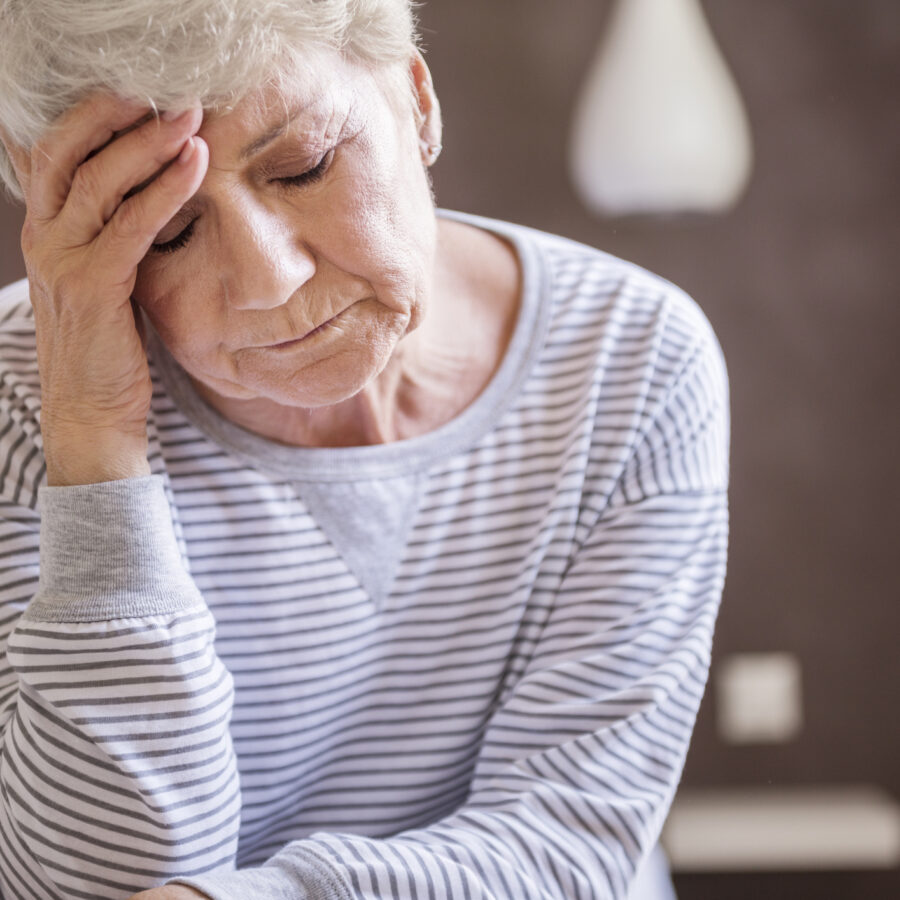 Seasonal depression in seniors can be difficult to manage. Here a senior woman feels blue.