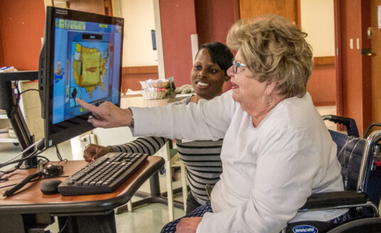 Bethesda resident Patricia Stirlen using the iN2L computer system for seniors at Bethesda Meadow.