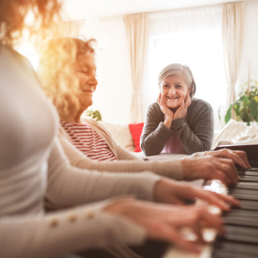 A senior woman explores music therapy for seniors. Music therapy benefits a seniors' mental, physical, and emotional health. Learn more about the Bethesda's music therapy program for seniors.