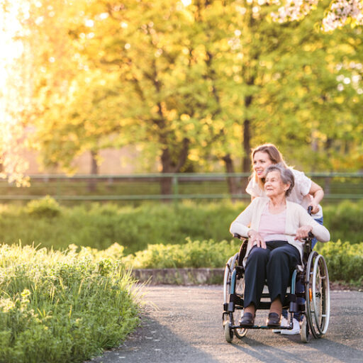 Myths about hospice care can cause negative assumptions. In fact, hospice care is more about improving or maintaining quality of life. Here, a woman walks with her elderly parent, celebrating the little things.