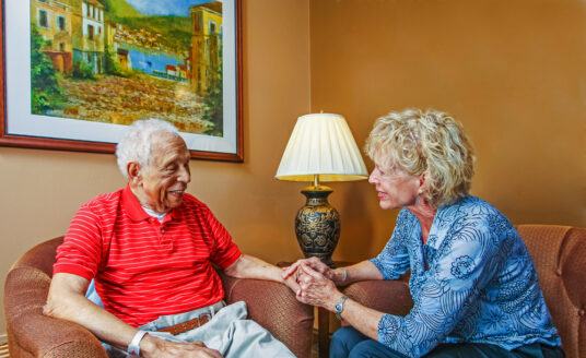 Volunteering at a senior care facility brings joy to seniors and volunteers. Here, a Bethesda volunteer comforts a senior resident.