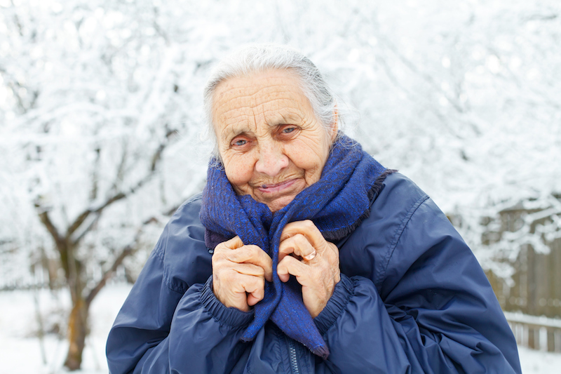 A senior woman is preparing for winter