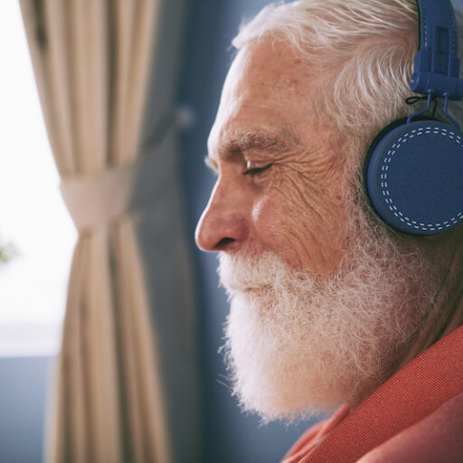 A man listens to music to manage sundown syndrome