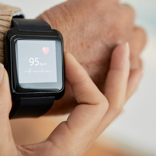 A senior wears an Apple watch to prevent heart disease