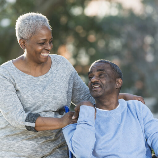 Senior caregiving is no easy task. Here, a senior woman cares for her senior husband.