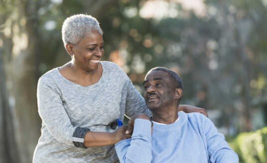 Senior caregiving is no easy task. Here, a senior woman cares for her senior husband.