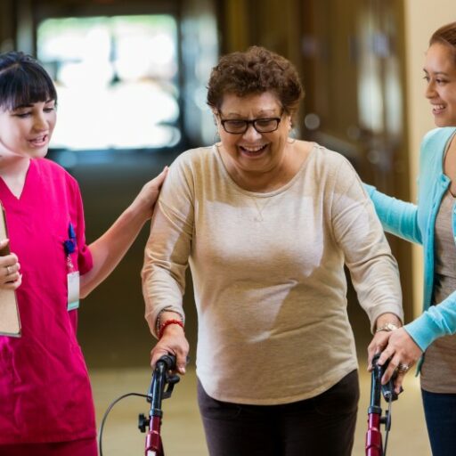 A Care Manager walks with a senior woman and her daughter. Providing a complete geriatric assessment is only one of the ways a care manager can help a family caregiver.