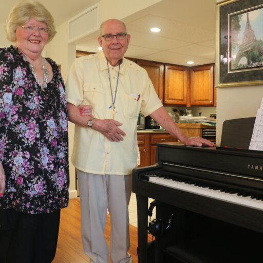 Jim and Judy Thielker, next to their piano in their apartment at Bethesda Terrace, an independent living community in St. Louis.