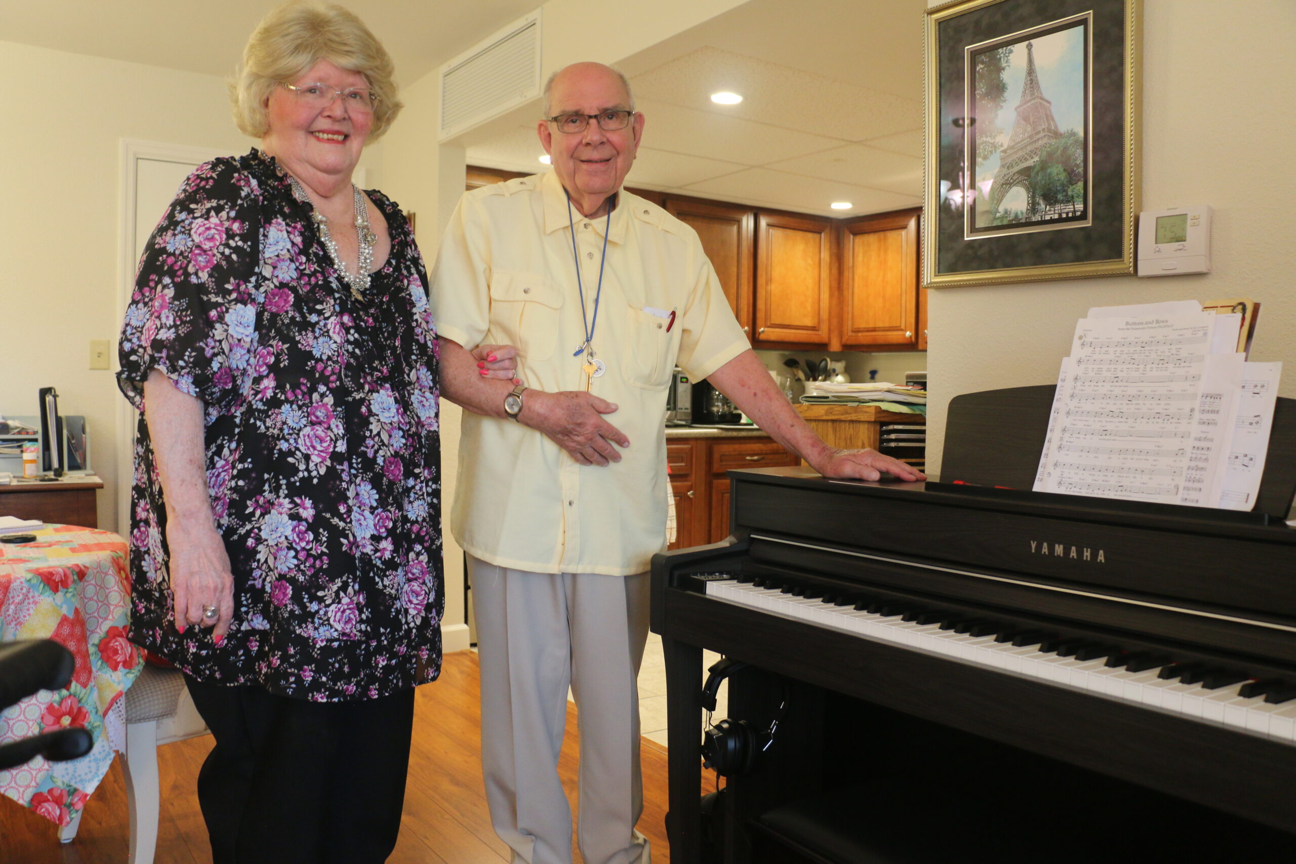 Jim and Judy Thielker, next to their piano in their apartment at Bethesda Terrace, an independent living community in St. Louis.