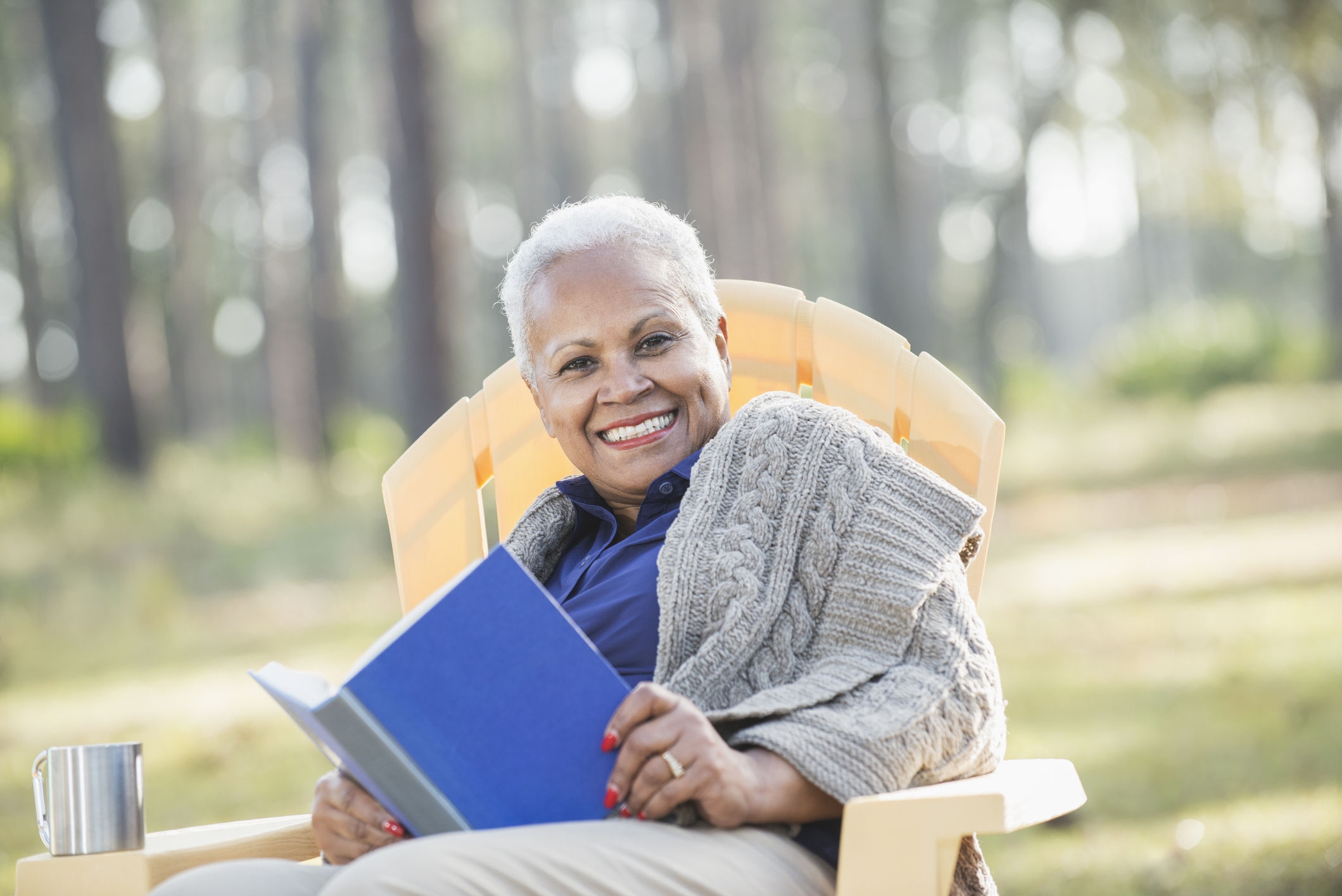 Women relaxes and celebrates her move to an assisted living community in autumn.