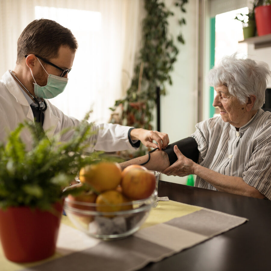 Home care professional caring for senior adult