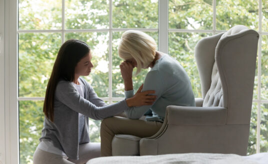 Daughter providing grief support to elderly mom