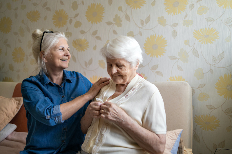 An older woman works with her senior mother to create a dementia care plan