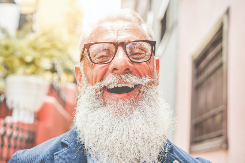 A senior man smiling and laughing | jokes for seniors