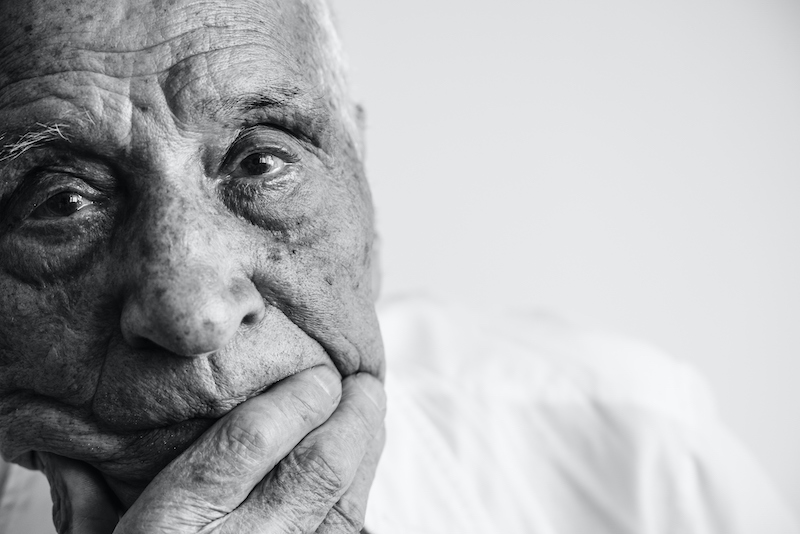 A senior man ponders mental health and aging.
