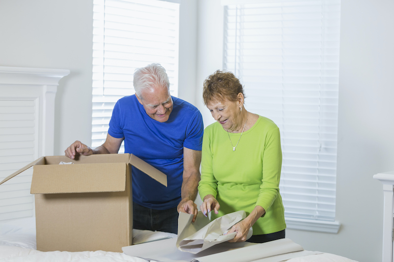 A senior couple packs up their home as they prepare for moving to an Independent Living Community.