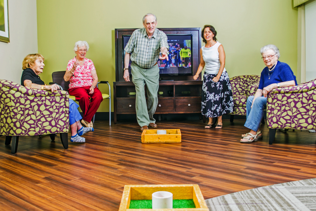 Seniors playing washers together at Bethesda Orchard