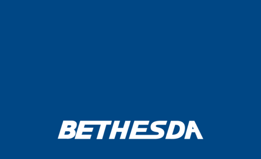 white Bethesda logo over a dark blue background