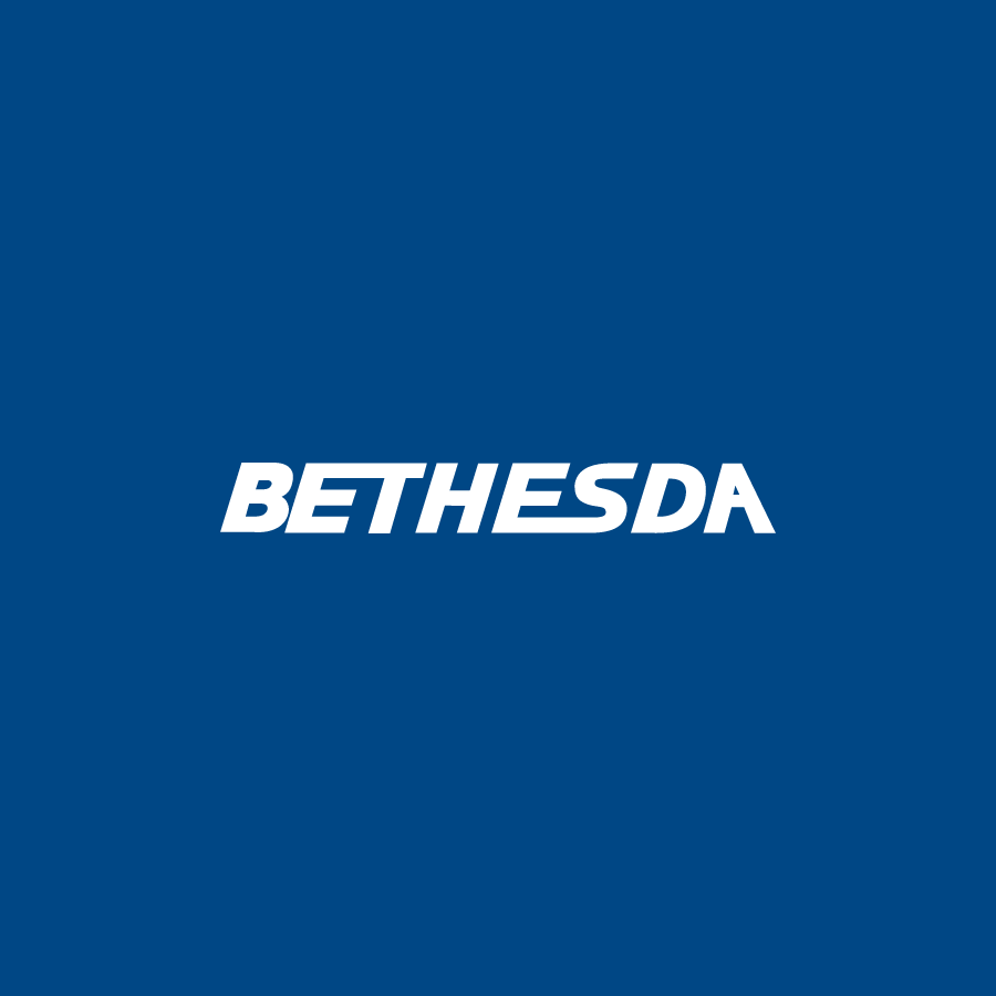 white Bethesda logo over a dark blue background