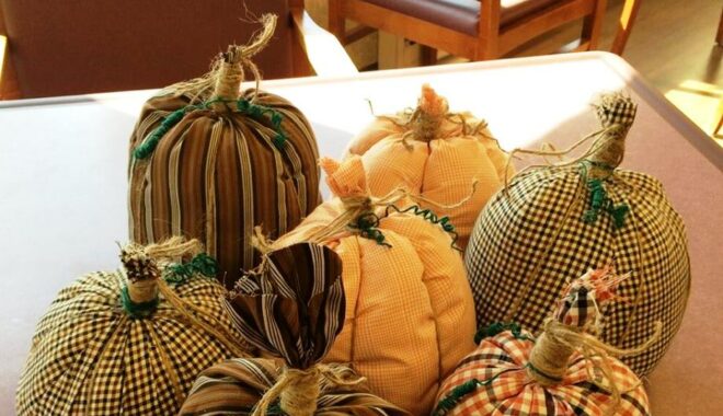 Making fabric pumpkins like these can be a fun and easy Halloween craft for seniors.