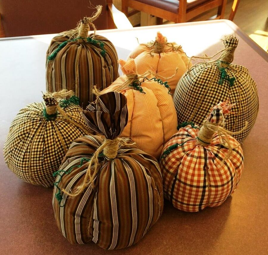 Making fabric pumpkins like these can be a fun and easy Halloween craft for seniors.