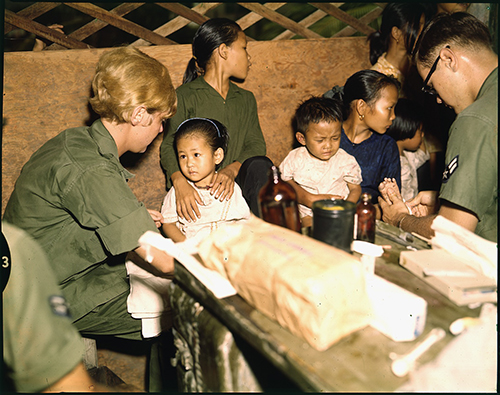 Second Lt. Kathleen M. Sullivan treats a Vietnamese child during Operation MED CAP. Credit: U.S. National Archives and Records Administration via Wikimedia Commons
