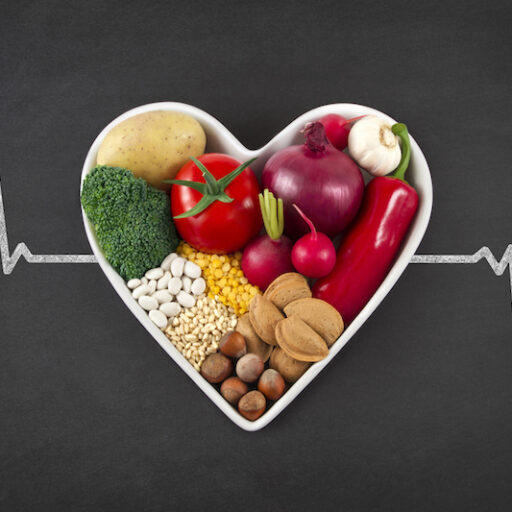 Heart-healthy foods inside the shape of a heart, with a pulse line going through the horizontal center.