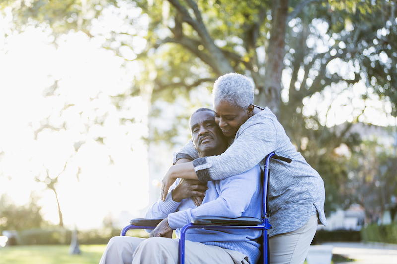 Senior Man in Wheelchair with his Senior Caregiver