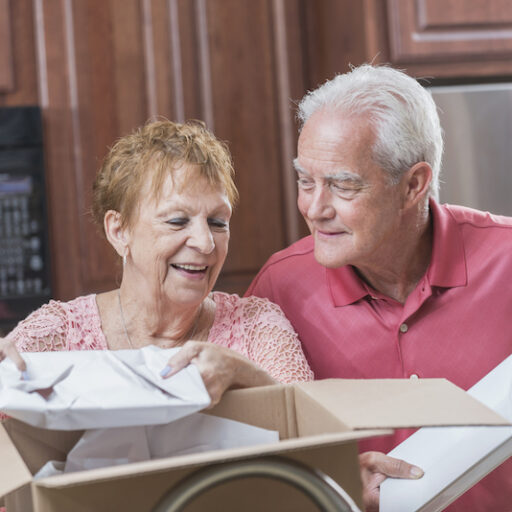older couple moving into their new senior living community