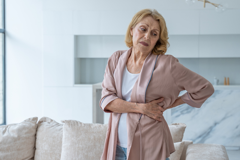 older woman dealing with chronic pain management