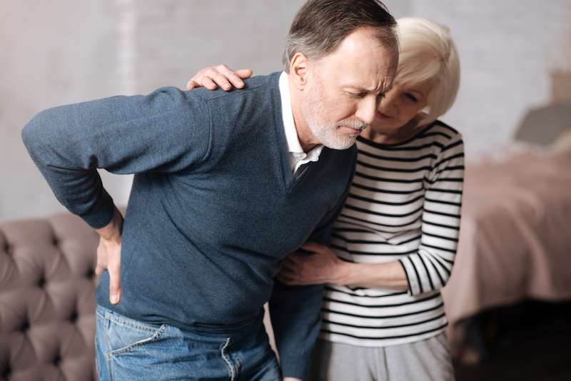 Senior man with terrible backache learning about how to increase quality of life