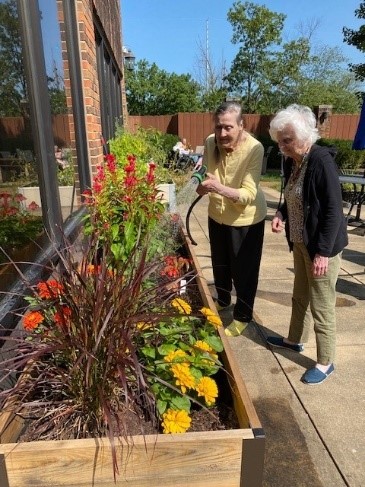 Dilworth residents enjoy tending to the raised garden beds from the Women's Board
