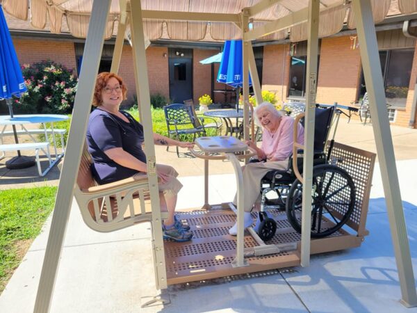 Southgate residents and loved ones enjoy the new Whisper Glider