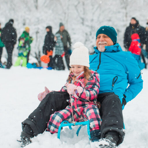 Senior sledding with grandchild | Winter Emergency Prep