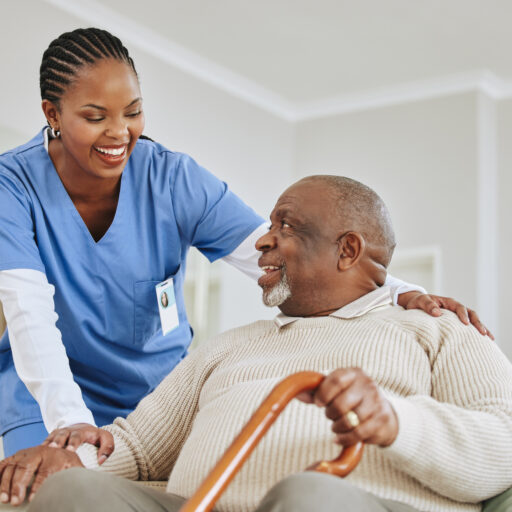 Caregiver talking to senior | At-Home Care for Seniors