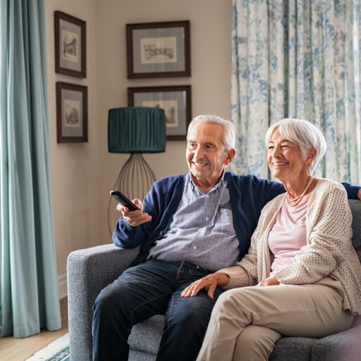 Senior couple watching tv shows and movies for seniors