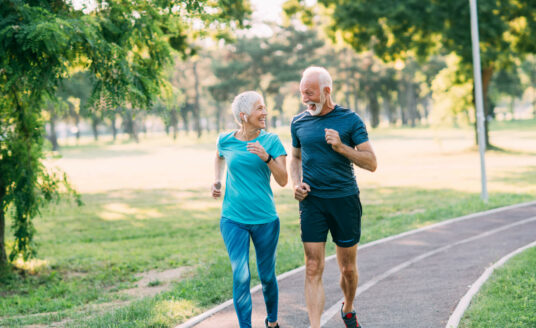 happy Senior couple running in outdoors
