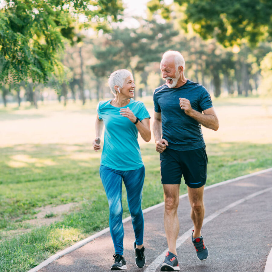 happy Senior couple running in outdoors