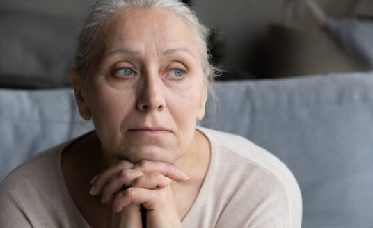 Female adult child dealing with caregiver burnout