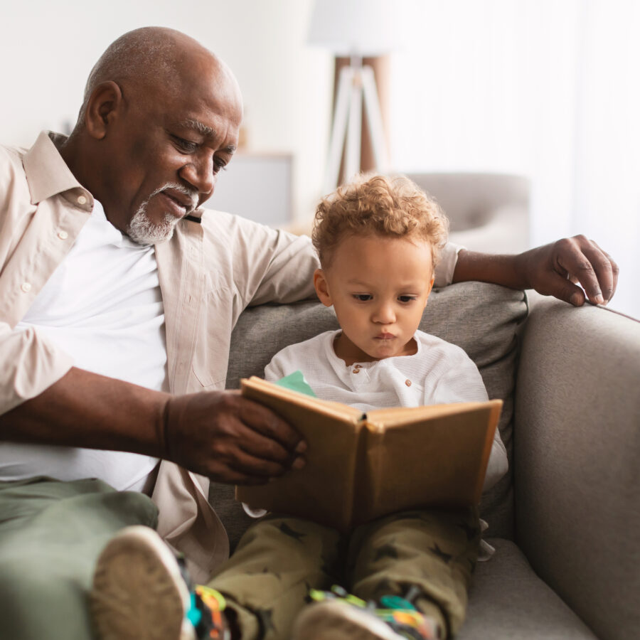 Family Bonding Activities | Grandfather reading to Grandson