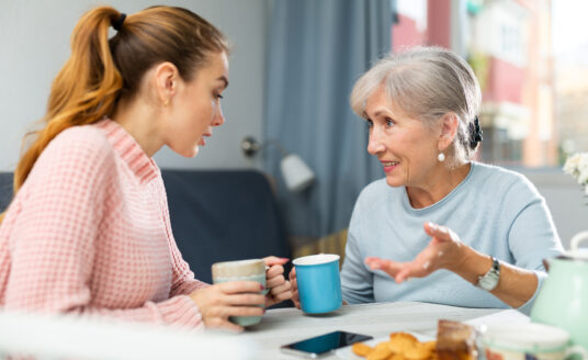 Senior mother and daughter discussing advanced care planning