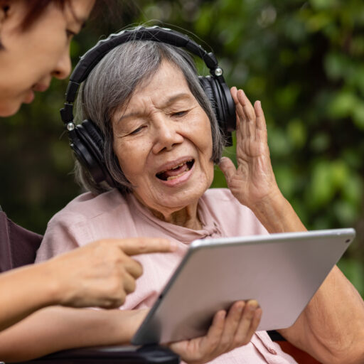 Senior woman listening to music demonstrating benefits of music for dementia patients