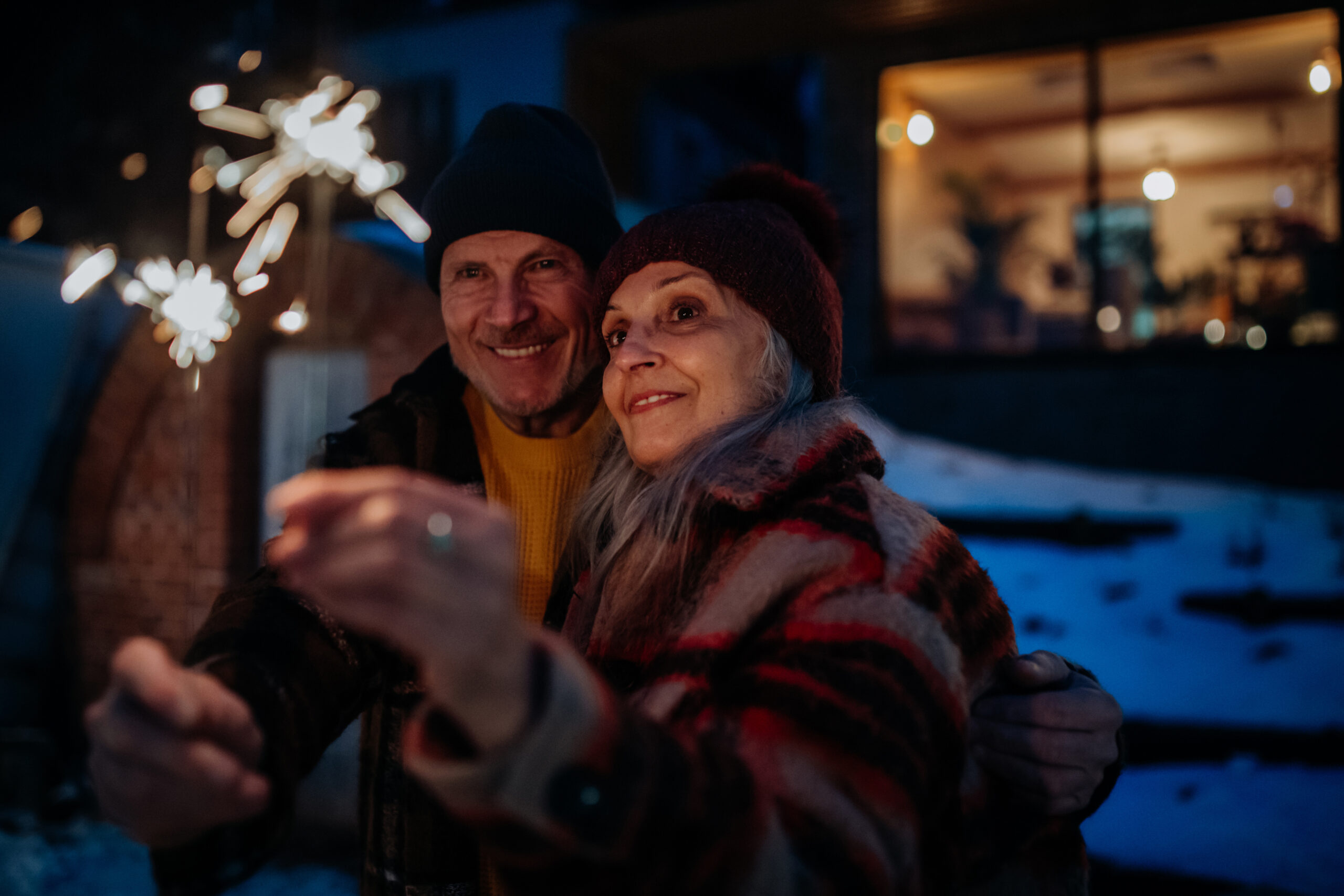 Seniors holding sparklers on New Year's