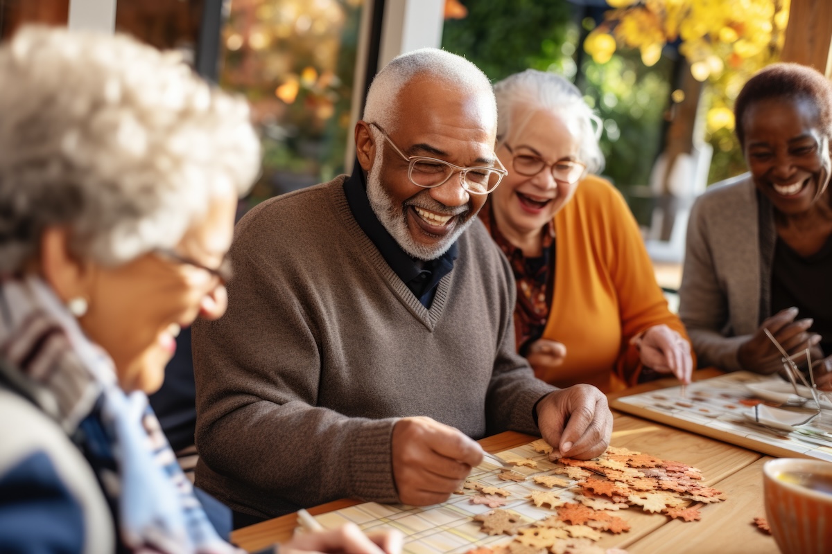 Senior friends completing a puzzle together.