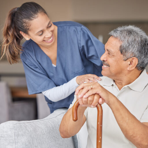 Senior care worker providing senior home care solutions to elderly man