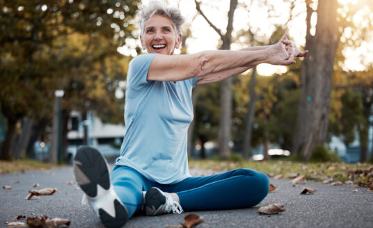 Woman performing hip stretches for seniors