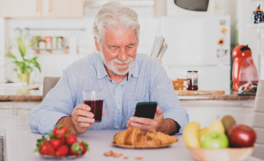 Senior man enters food in top nutrition